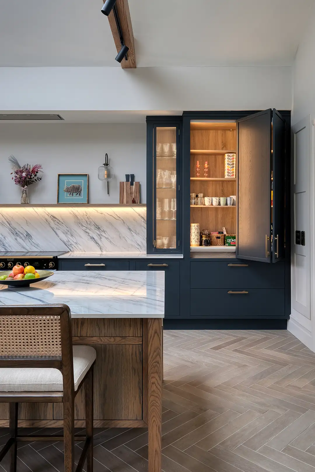 A craftsman meticulously finishing a piece of wooden cabinetry.